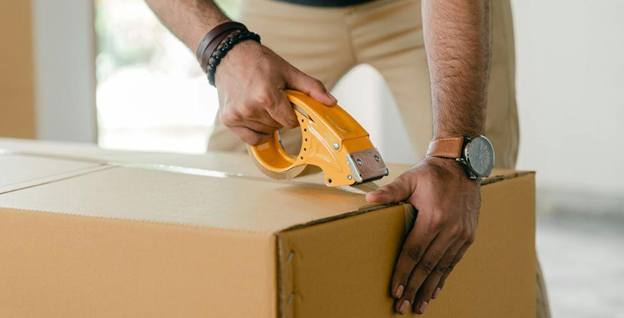 A man packing a box