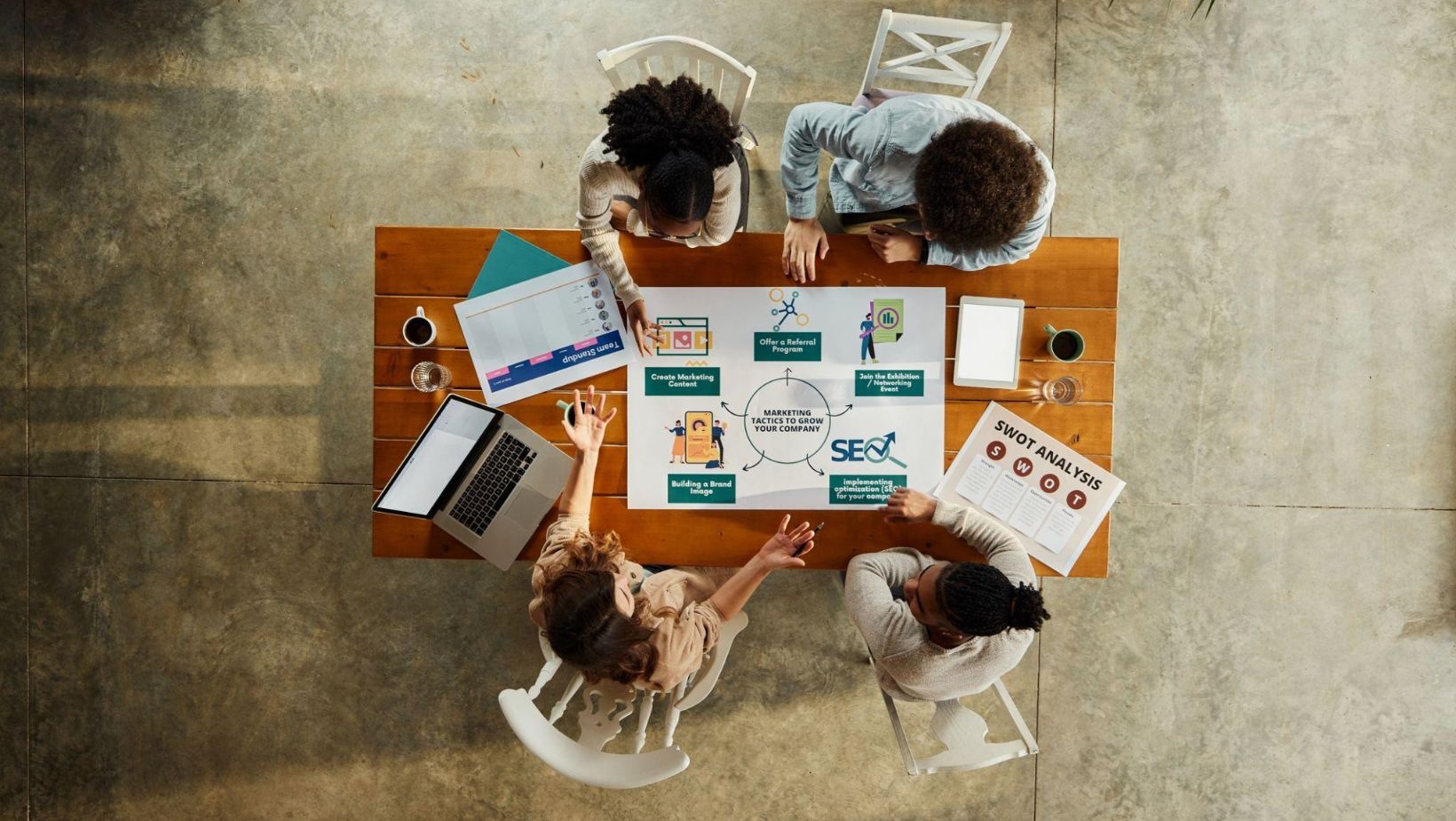 Collaborative meeting with professionals analyzing data and documents to drive strategic business growth